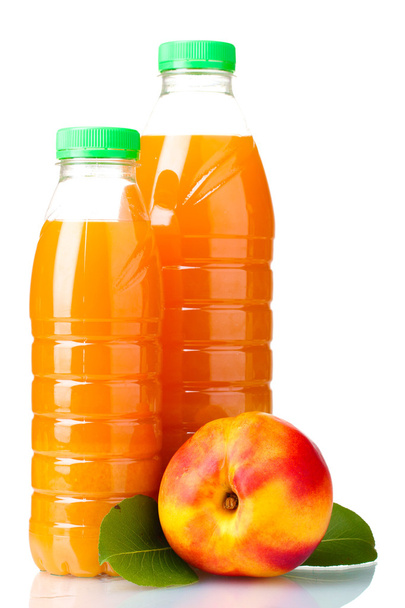 Peach juice in bottles and nectarine isolated on white - Foto, immagini