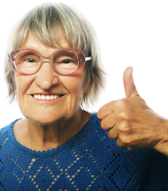 Old woman showing ok sign on a white background - Photo, Image