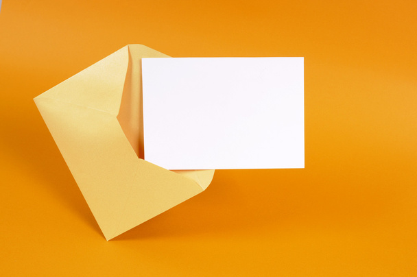 Gold envelope with blank message card - Fotoğraf, Görsel