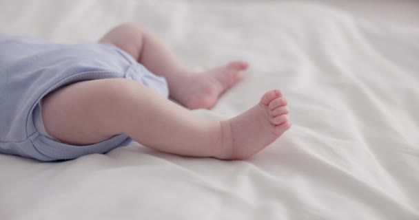 Adorable, family and feet of baby on bed for child care, relax and resting in nursery. Innocent, cute and closeup of toes of innocent newborn infant for health, wellness and development at home. - Footage, Video