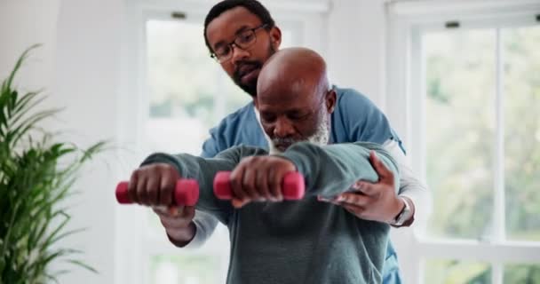 Nurse, dumbbells and physiotherapy of senior black man, exercise or rehabilitation. Caregiver, person and weight training, help and fitness in recovery for healthy body, muscle and physical therapy. - Séquence, vidéo