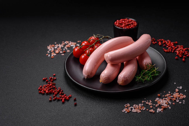 Delicious fresh vegetarian sausage or sausage made from vegetable protein tofu or seitan legumes, lean wheat with salt and spices on texture background - Photo, Image