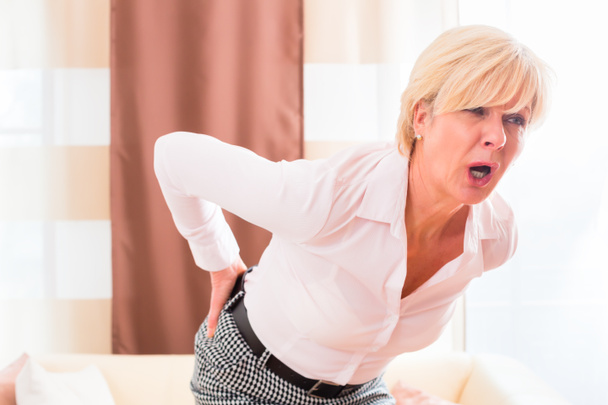 Senior woman having back pain - Photo, Image