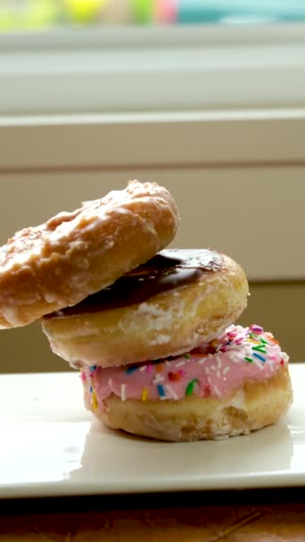 From above sweet tasty donuts with different glazing on wooden table . High quality FullHD footage - Footage, Video