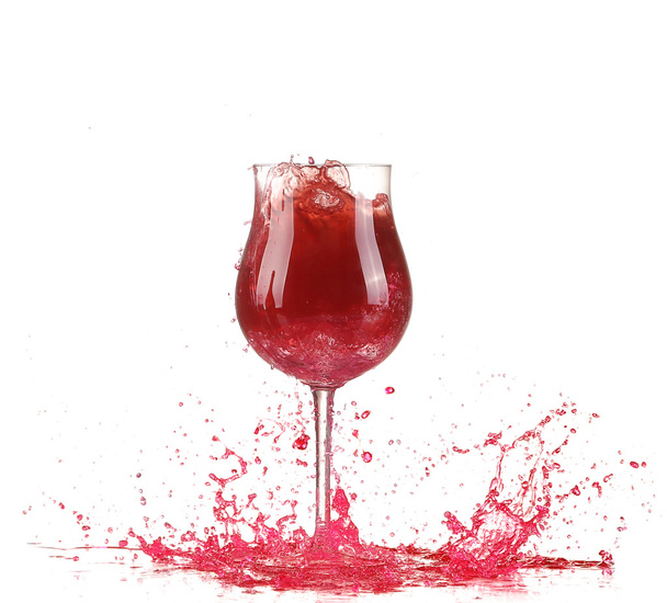 Glass with red wine splash - 写真・画像