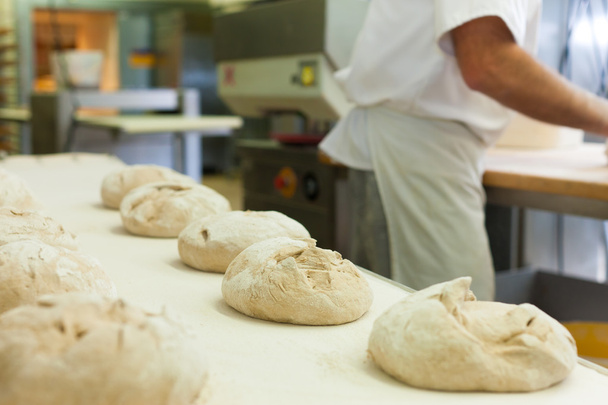 Male baker baking bread - Photo, Image