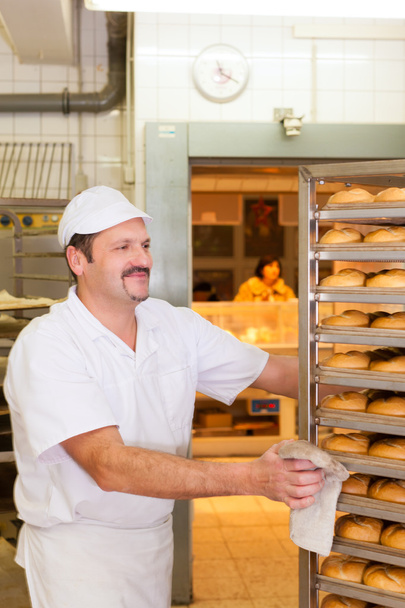 Baker in his bakery - Photo, Image