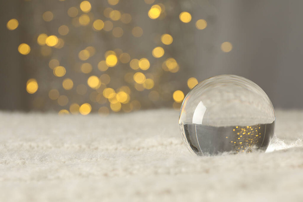 Glass ball on gray background, space for text - Photo, Image