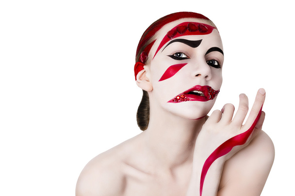 Studio portrait of a woman. Art make-up in red. - Фото, изображение