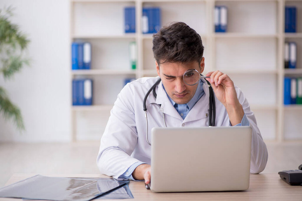 Young doctor in telemedicine concept - Photo, Image