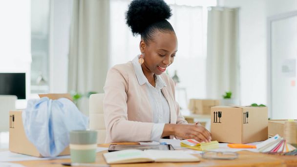 Happy black woman, fashion designer and box in small business planning or logistics at boutique store. African female person smile for clothing package, parcel or cargo in delivery or courier service. - Фото, изображение