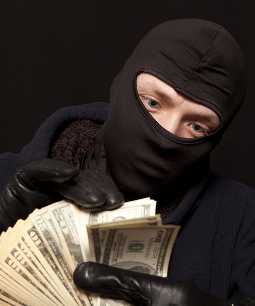 Thief and cash - Foto, afbeelding