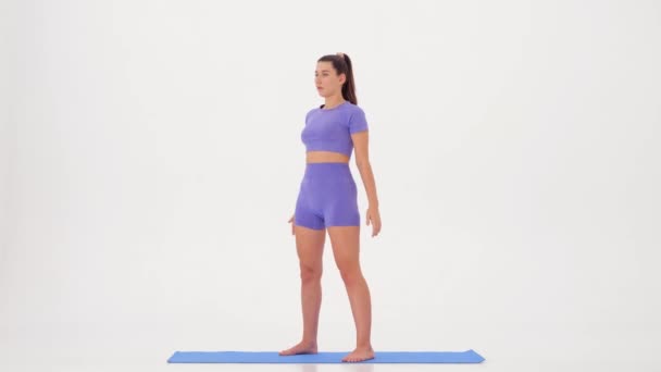  Fitness workout. Sporty Woman doing Exercising on a white background. slow motion. exercise name - air squats  - Footage, Video