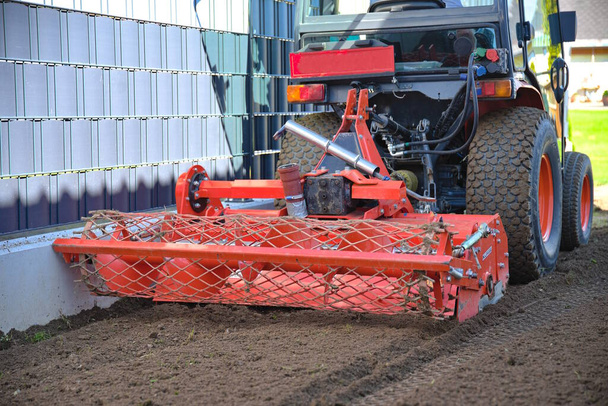 Soil loosening and tillage with reversible tiller and small tractor - tiller - Photo, Image