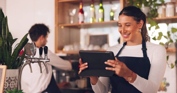 Happy woman, cafe or barista on tablet for small business owner, social media update or sales promotion. Waitress, startup or person laughing on technology for coffee shop news or restaurant online. - Photo, Image