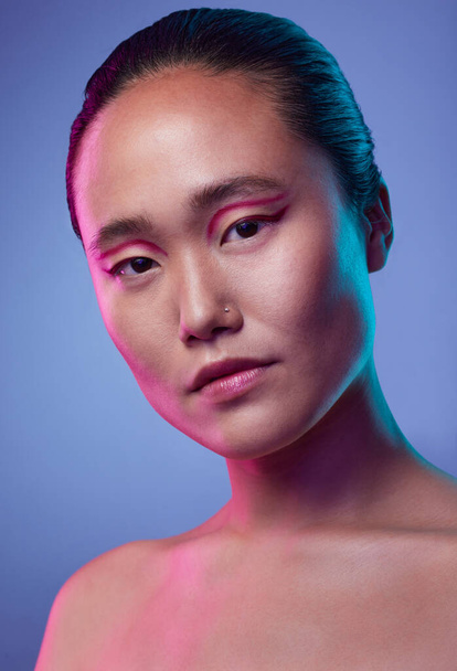 Its more than skincare, its how to love. an attractive young woman posing in studio against a purple background - Valokuva, kuva