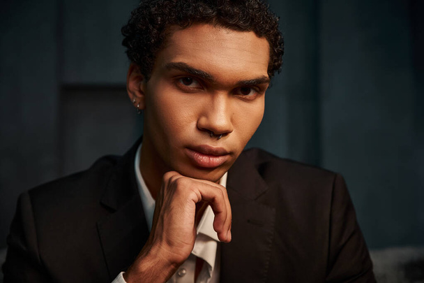 appealing good looking african american male model in elegant suit posing and looking at camera - Photo, Image