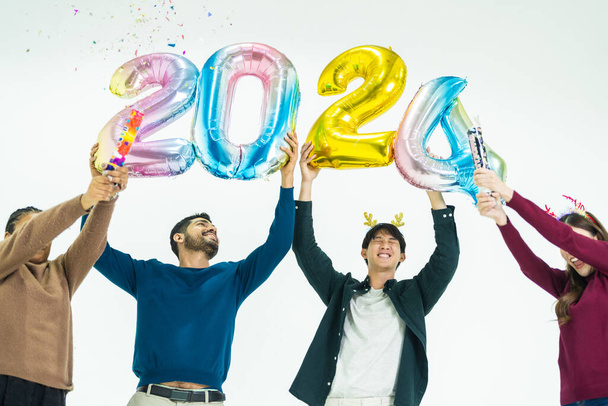 group of people holding fantasy color balloons bubble of the number 2024 for the new Year. men and women standing on a white background. celebration of happy new year Party - Photo, Image