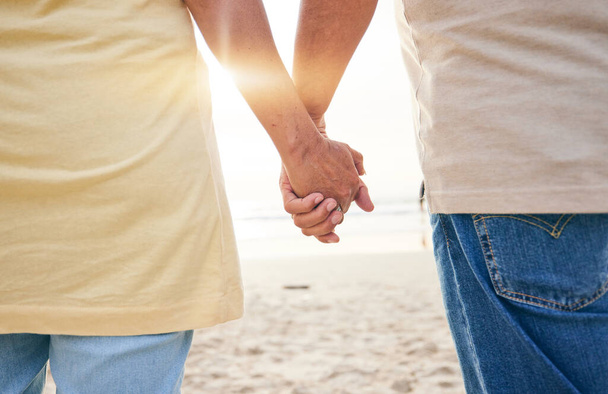 Senior, love and couple holding hands at the beach in support or help of health crisis, cancer or mental health problem. Old people, empathy and solidarity in depression, anxiety or trust or comfort. - Photo, Image