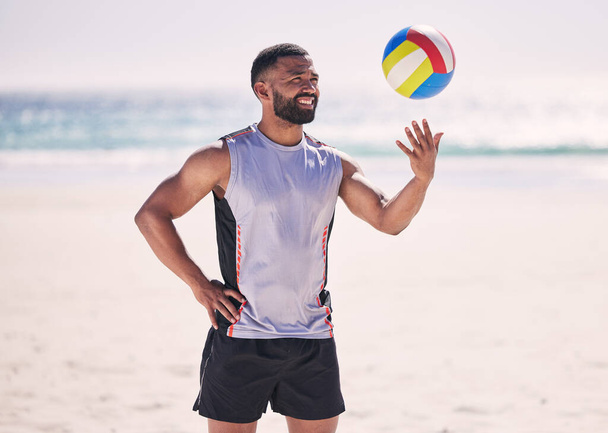 Holiday, volleyball or happy man at beach with ball playing game, workout training or fitness in summer. Air, sports athlete smiling or player ready to start practice match or exercise at ocean alone. - Photo, Image