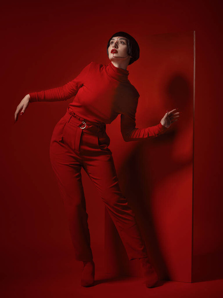 Fashion, art and makeup, woman with red board, futuristic cosmetics and unique studio background. Future aesthetic, retro culture and creative beauty, body of model in luxury designer brand clothes - Photo, Image