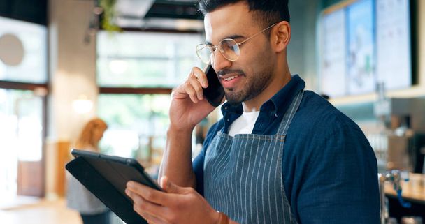 Barista, phone call and tablet for restaurant communication, online management or customer service in cafe. Small business owner, waiter or man on mobile and digital inventory for coffee shop startup. - Photo, Image