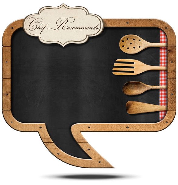 Blackboard in the shape of speech bubble with wooden frame, copy space, label with text Chef Recommends, checkered tablecloth and wooden kitchen utensils, isolated on white background.  - Photo, Image