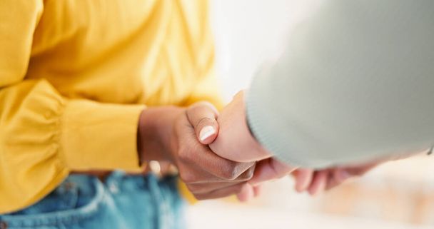 Couple, closeup and holding hands in house together for support, bonding and love with care for communication. People, helping and link for empathy, kindness and connection with trust in apartment. - Photo, Image
