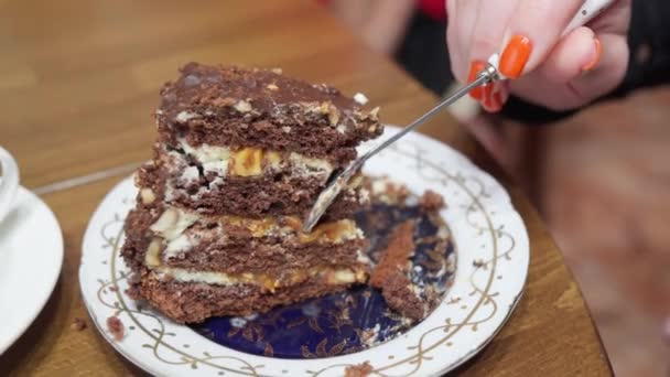 Woman eats sweet cake with teaspoon. - Footage, Video