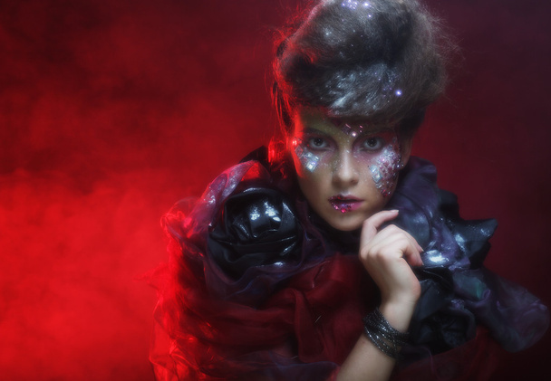 young woman with bright fantasy make up - 写真・画像