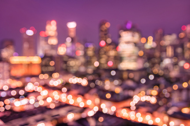 Bokeh filter of Singapore skyline from above during the blue hour - Asian modern city scape with spectacular nightscape panorama - Blurred defocused night lights on a violet marsala filtered editing - Photo, Image