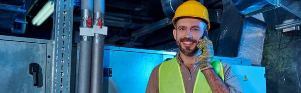 joyous technician in safety helmet talking by phone and looking at camera, data center, banner - Photo, Image