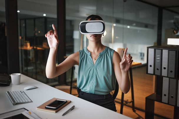 Vr, metaverse and business woman in virtual reality exploring cyber world in office at night. Futuristic, technology and female employee with digital headset with ai software for 3d internet browsing. - Photo, Image