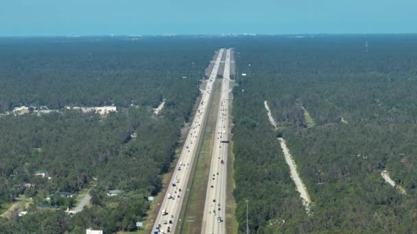 Aerial view of American freeway with many driving cars during rush hour in Florida. View from above of USA transportation infrastructure. - Footage, Video