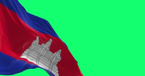 Detailní záběr kambodžské národní vlajky vlnící se na zelené obrazovce. Modré, dvojité červené, modré pruhy, uprostřed Angkor Wat. Bezproblémová 3D vykreslování animace. Chromatický klíč. Pomalý pohyb. 4K. Selektivní zaměření - Záběry, video