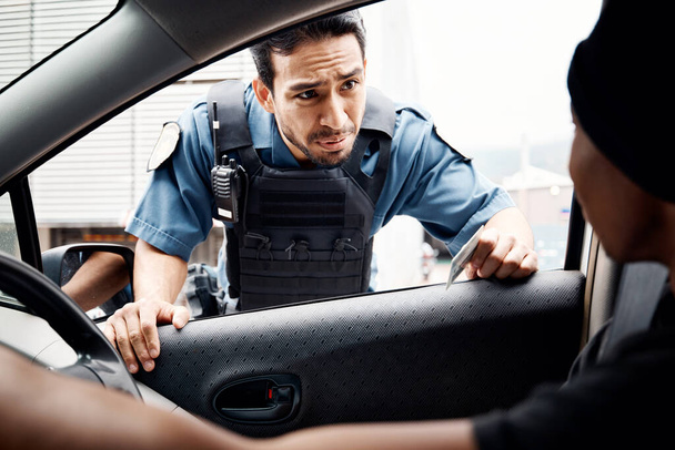 Talking, drivers license or policeman in city to check info for law enforcement, protection or street safety. Questions, traffic stop or Asian cop on security patrol for road block or crime justice. - Photo, Image
