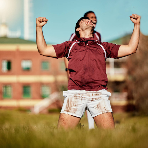 Rugby success, fitness man and sport celebration on a grass field for sports competition and match. Training, excited athlete and team win with exercise achievement from game workout outdoor. - Photo, Image