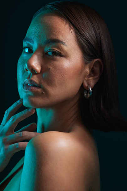 Body care, cosmetic and portrait of woman in a studio with a natural, health and moisturizing treatment. Beauty, self care and Asian female model with a soft glowing skin by a dark black background - Fotoğraf, Görsel