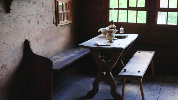 Wooden furniture in Chalet interior. detail close-up of rural farmhouse, table and chairs. Simple rustic living, handmade - Photo, Image