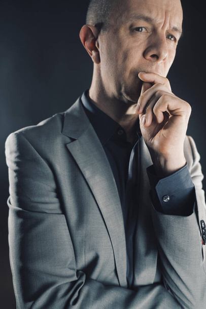 Businessman 50s in suit thinking portrait photo studio shot plain background. - Photo, Image