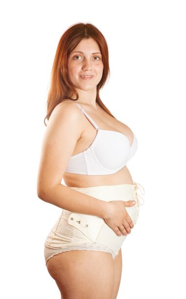 Pregnant woman wearing maternity girdle - Foto, afbeelding