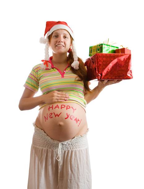 Pregnant woman with christmas gifts - Foto, afbeelding