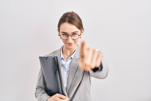 Young caucasian woman wearing business clothes and glasses pointing displeased and frustrated to the camera, angry and furious with you  - Photo, Image