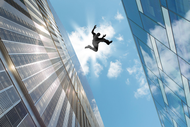 Man Jumping Over the Roof - Photo, image