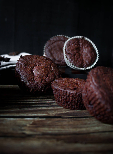 chocolate muffins on a black background. - Photo, Image
