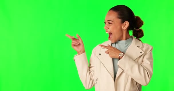 Woman face, hand pointing and wow for green screen, news or surprise sale on mockup studio background. Omg, portrait and excited lady model with finger sign for coming soon, promotion or announcement. - Footage, Video