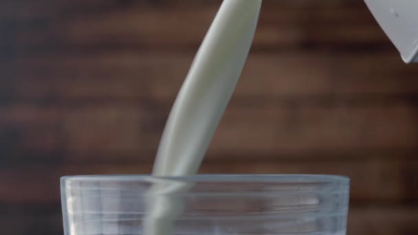 Pouring milk on a glass, - Footage, Video