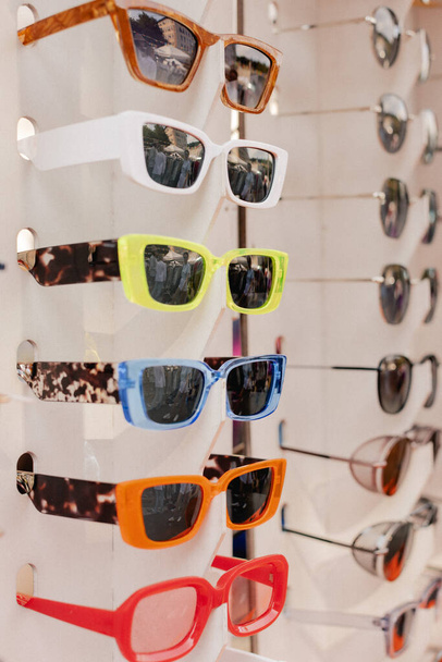 Eyeglasses Optical Store. Fashion eyewear at street market. Colorful glasses in optical store shopping mall (Selective Focus) - Photo, Image