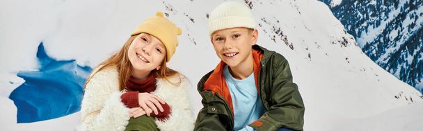 jolly little friends in warm stylish outfits smiling cheerfully at camera, fashion concept, banner - Photo, Image