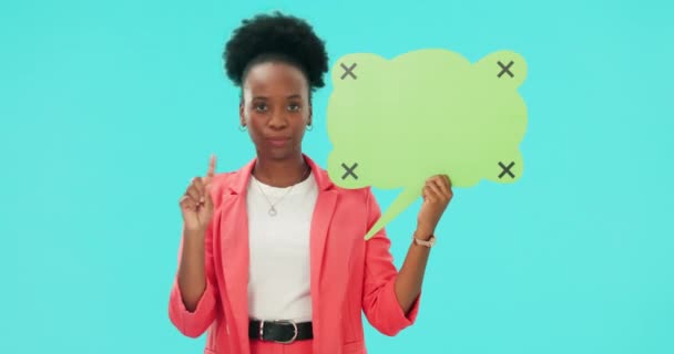 Woman, speech bubble poster and face for no, shaking head and finger for bad review for vote by blue background. African girl, student or mockup space for social media, opinion and feedback in studio. - Footage, Video